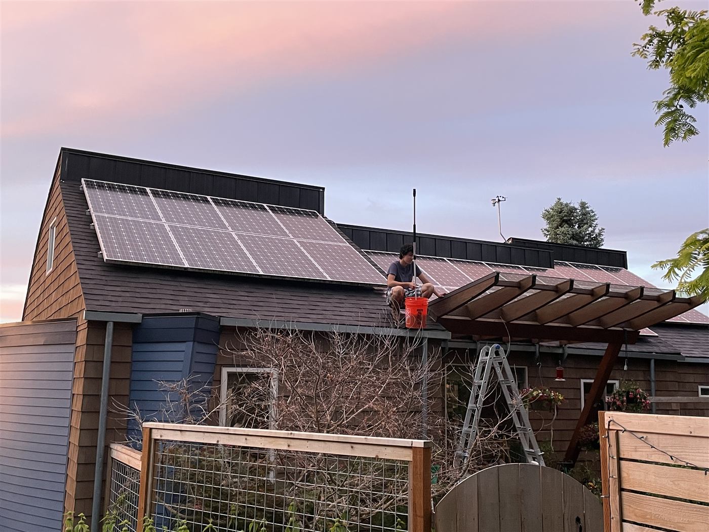 Solar panel cleaning at sunset in Bellingham WA